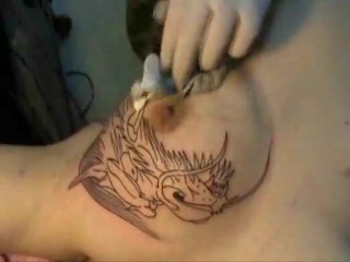 Tattooing Dragon Head on Tit !