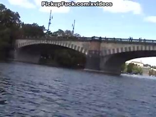 Blonde sucks shaft on a boat in full view of the city