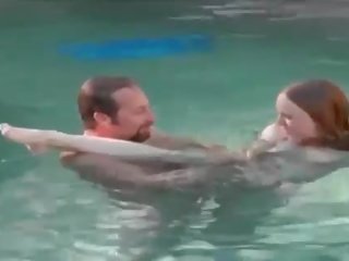 Redhead hottie eats member underwater for cash